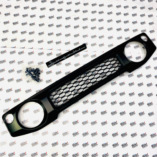 Jimny   front grille with cursive logo design