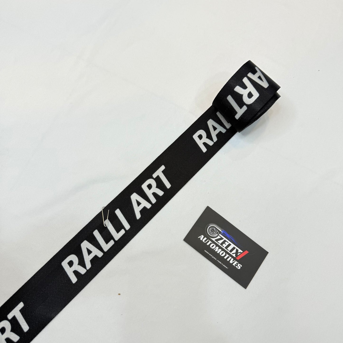 Aftermarket Ralliart black seat belt strap