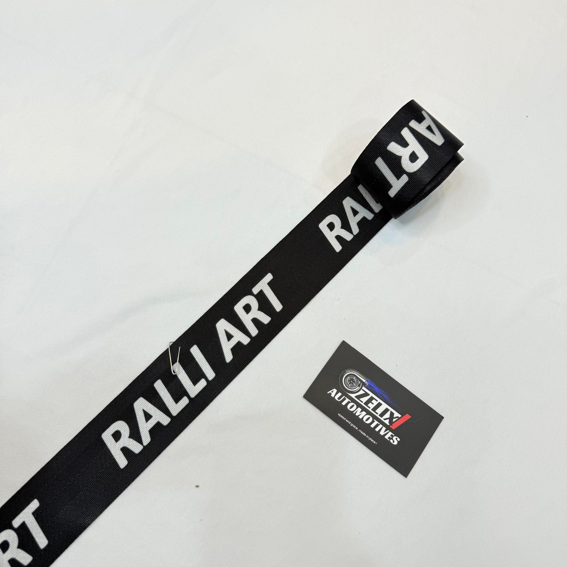 Aftermarket Ralliart black seat belt strap