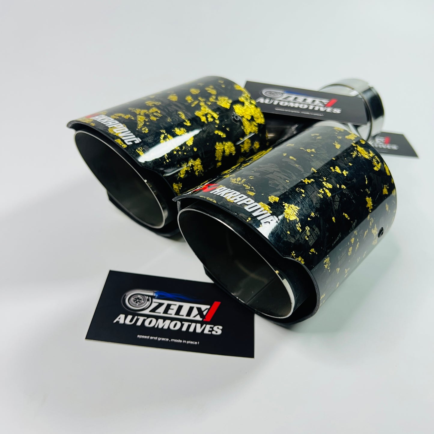 Side profile display of yellow forged carbon dual tip with stainless steel core