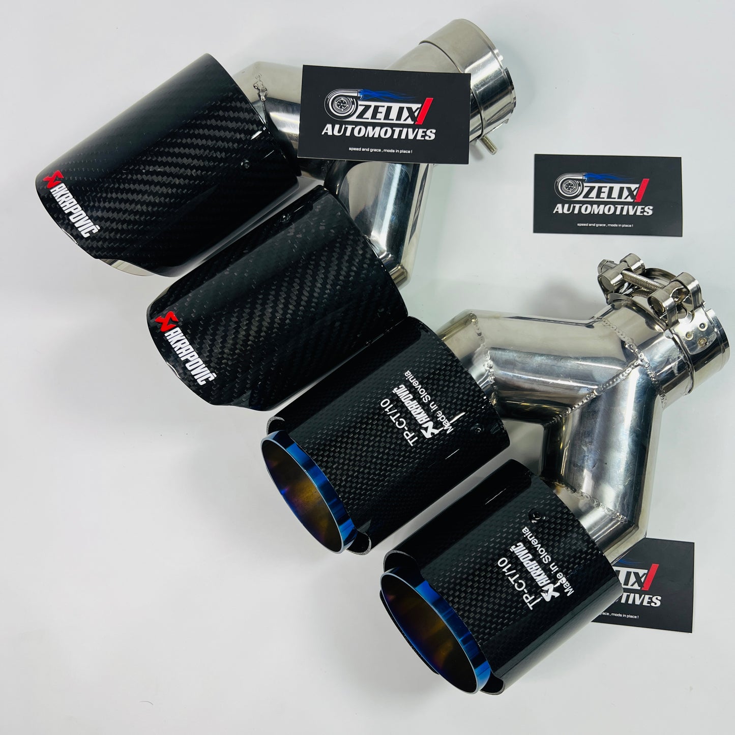 Gloss carbon dual exhaust tip with titanium-burnt outlets shown from the front