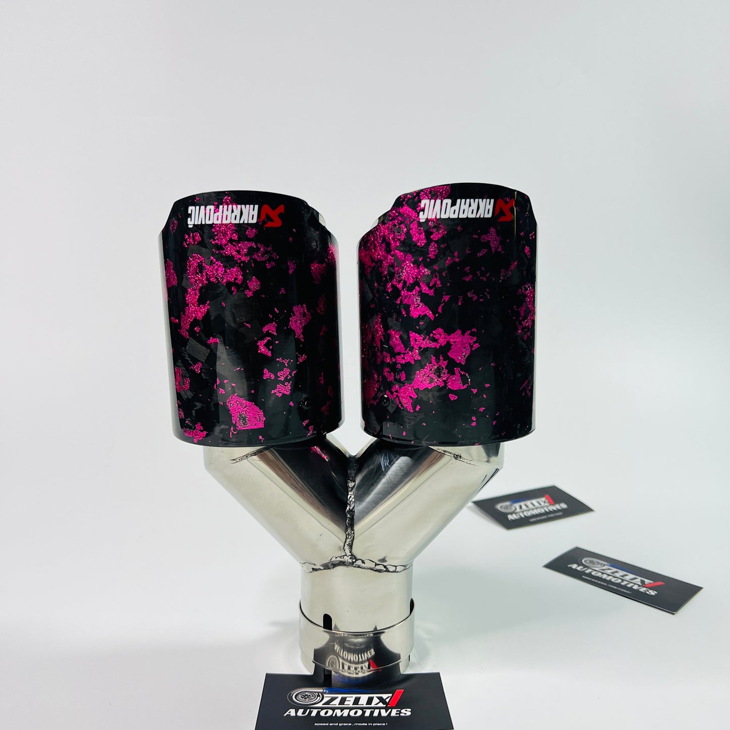 Close-up showcasing the intricate pink forged carbon weave and gloss coating