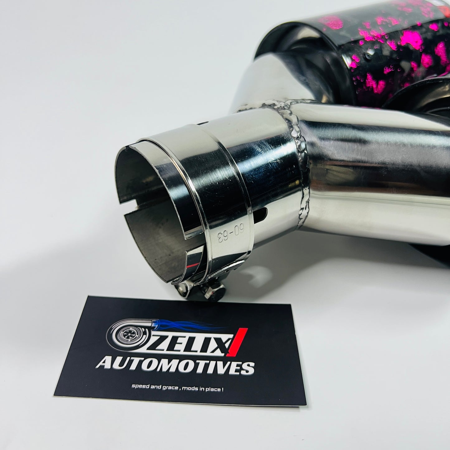 Side profile emphasizing the stainless steel Y-joint and pink carbon finish