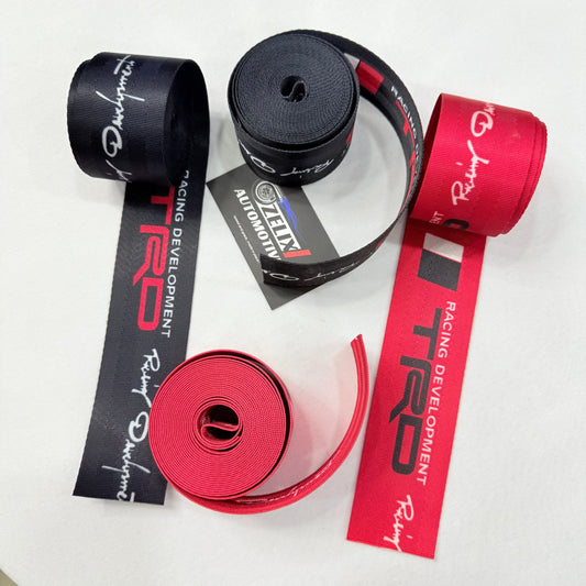Premium TRD seat belt webbing rolls in black and red