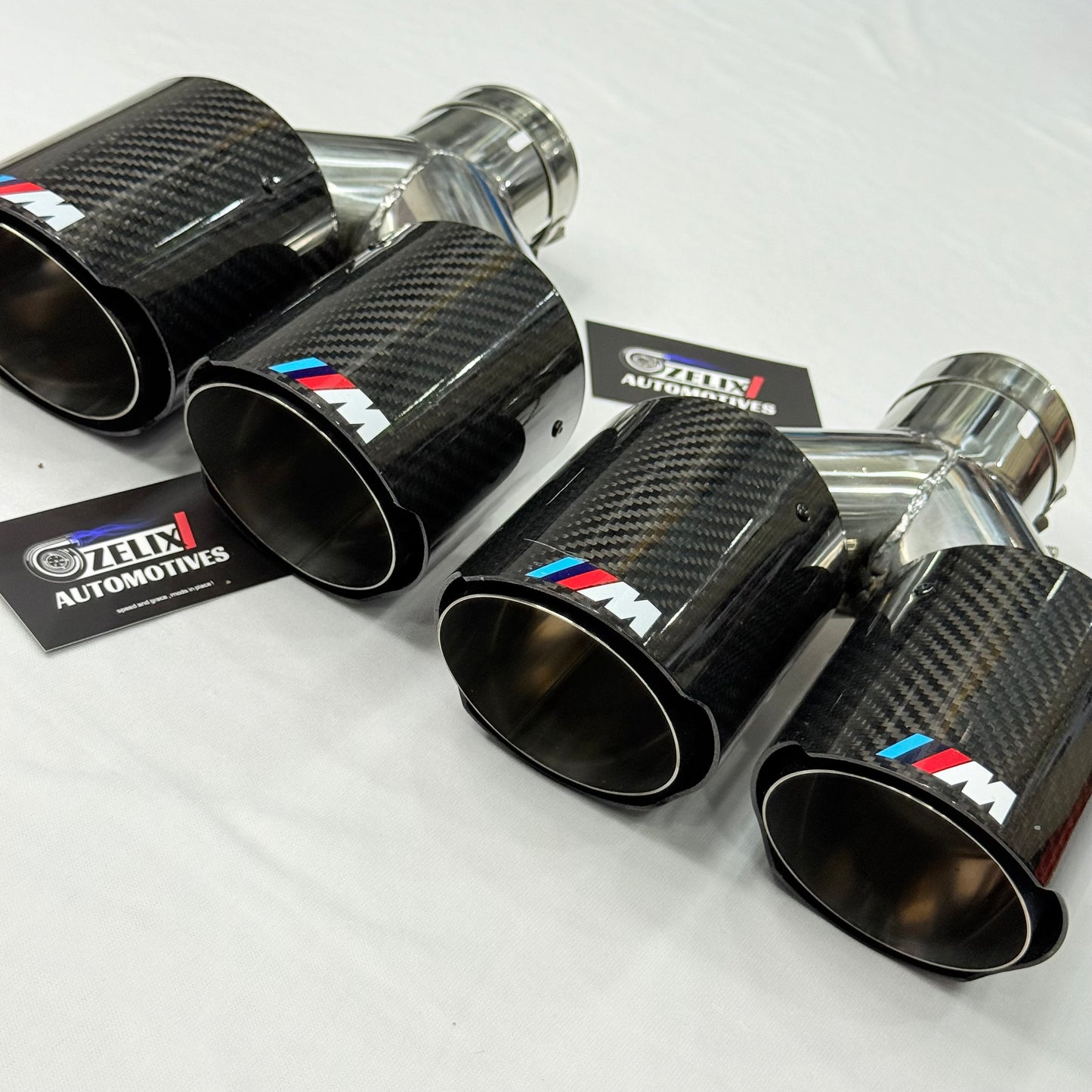 Close-up highlighting the 2×2 carbon fiber weave and glossy finish