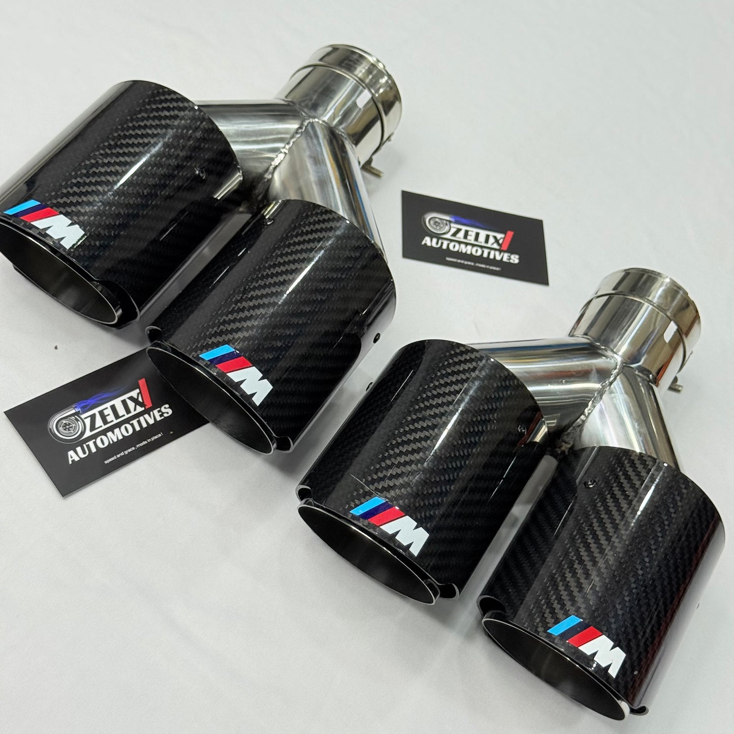 BMW M Performance dual carbon fiber exhaust tip dual outlets, front angle view