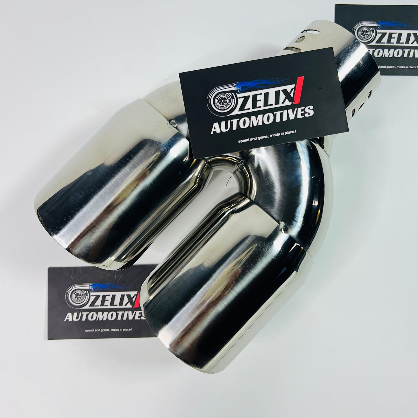Dual round dual-exit stainless steel exhaust tip displayed from the front