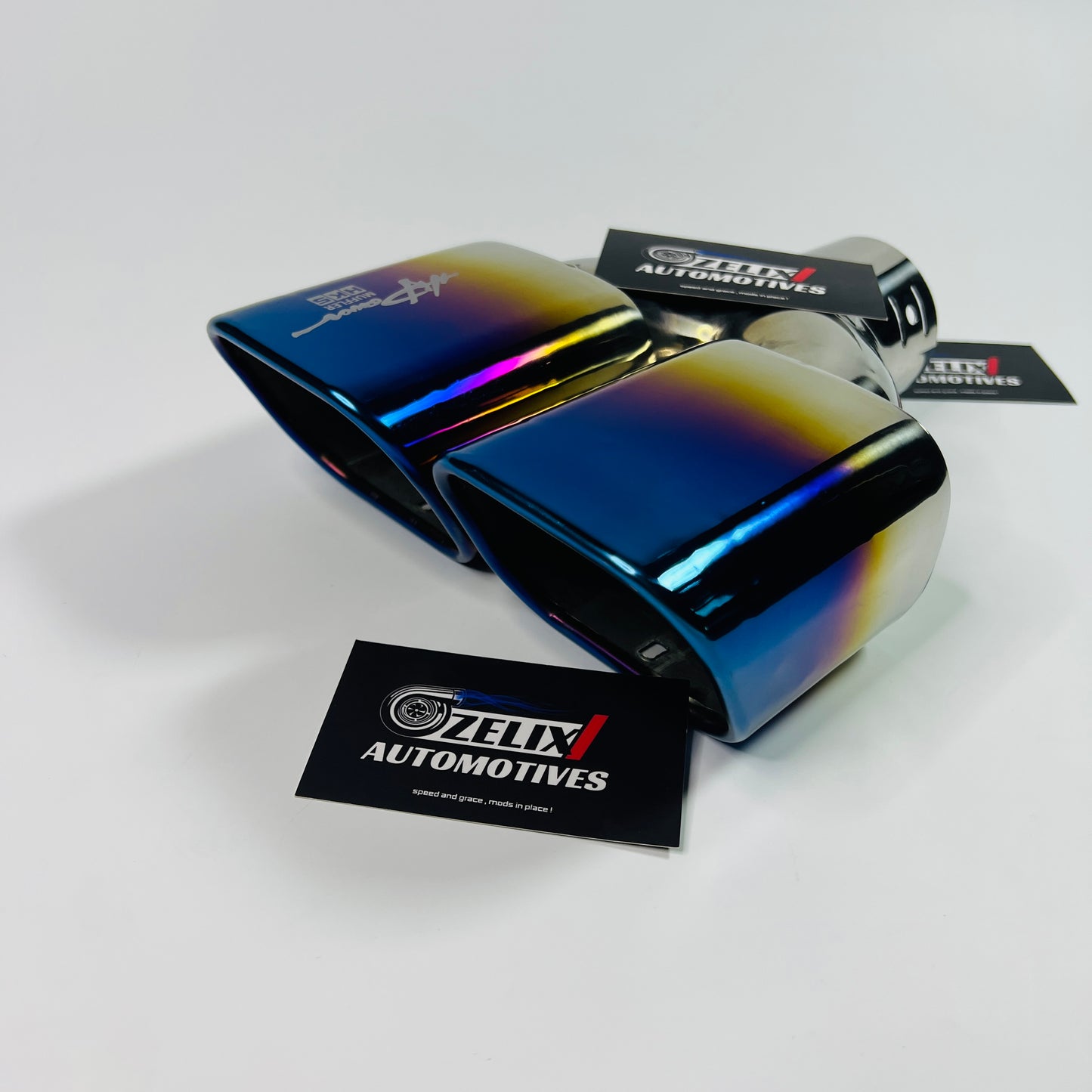 Angled side view of the square twin‑exit stainless steel exhaust tip