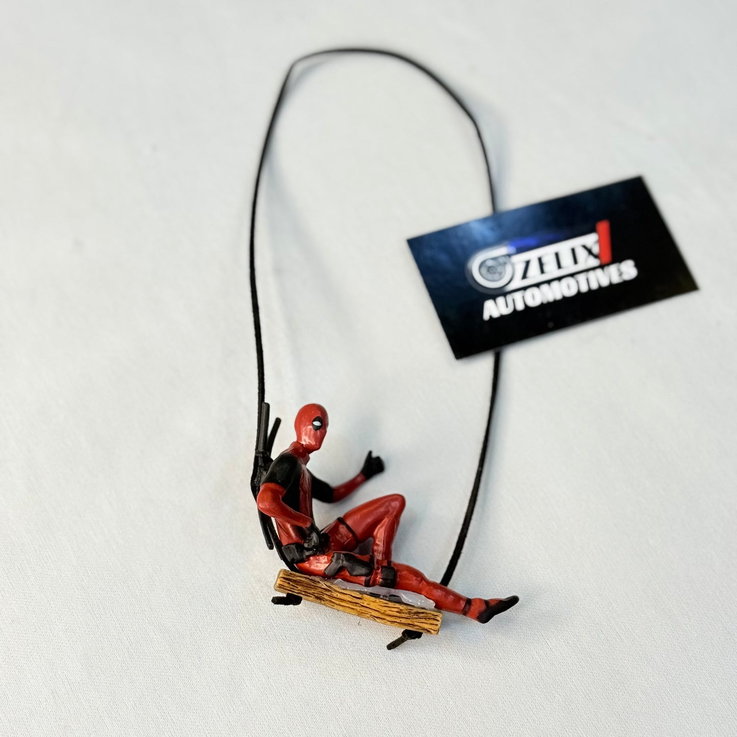 Deadpool mirror hanging displayed for car