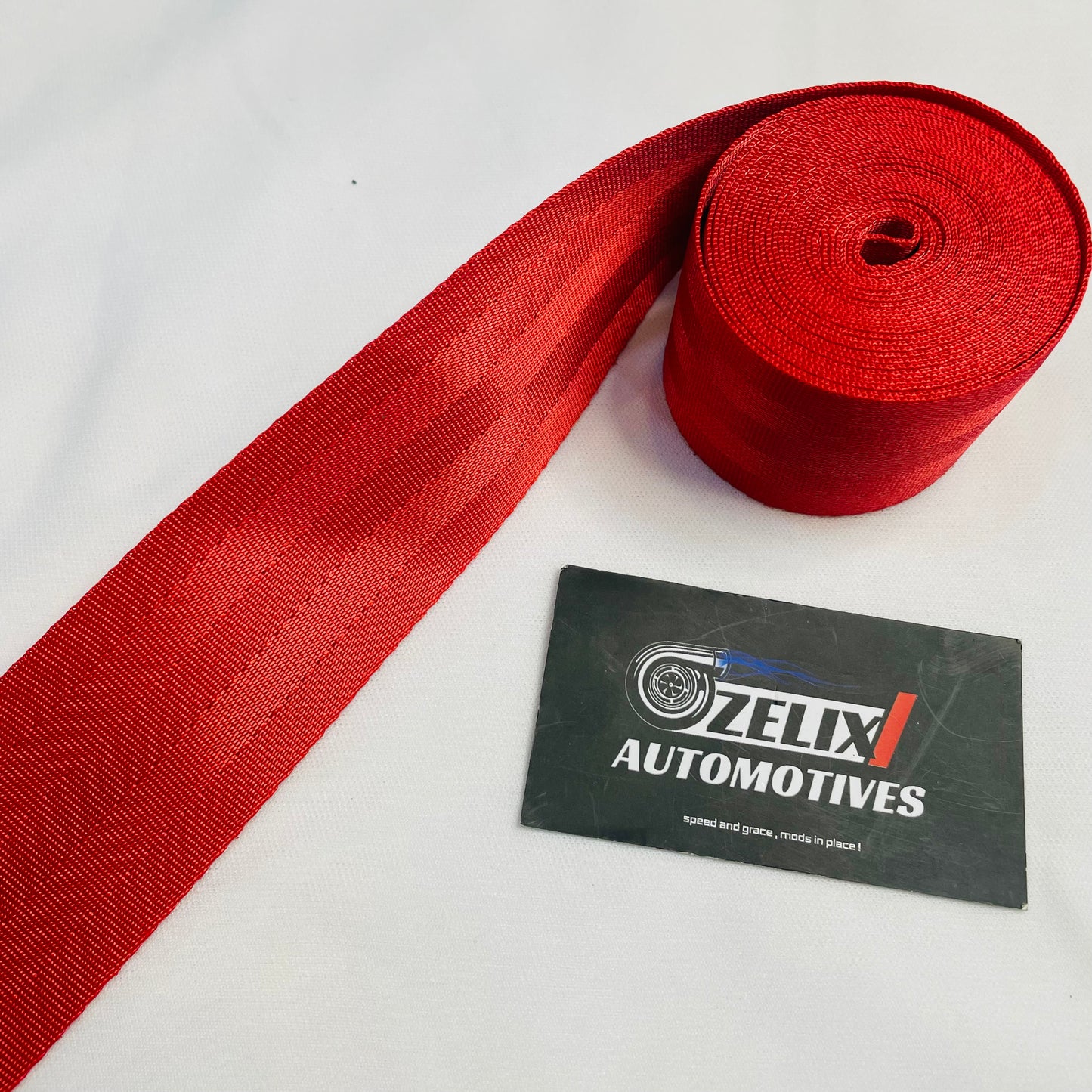 Aftermarket plain seat belt webbing in Red