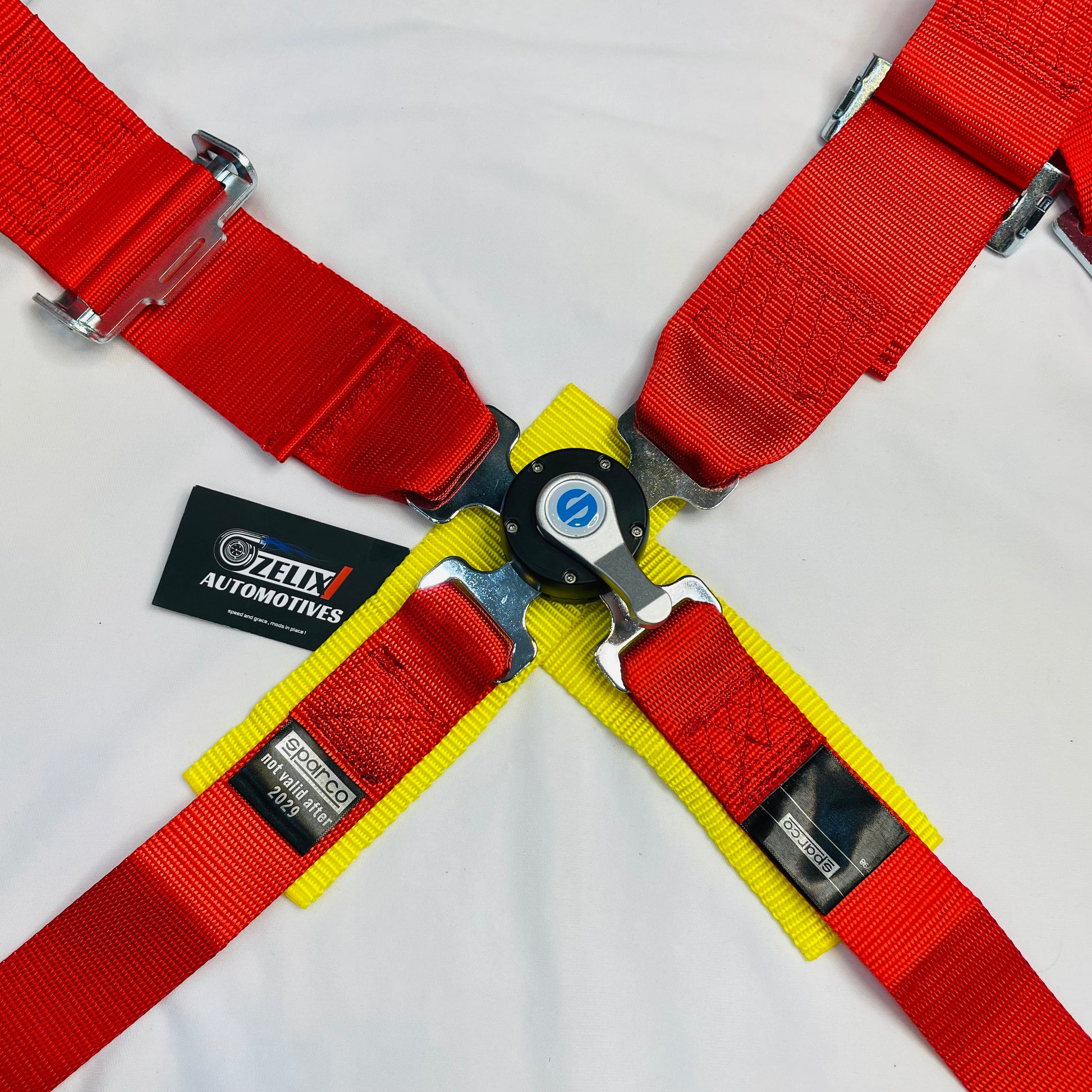SPARCO universal 4-point racing seat belt harness in red.