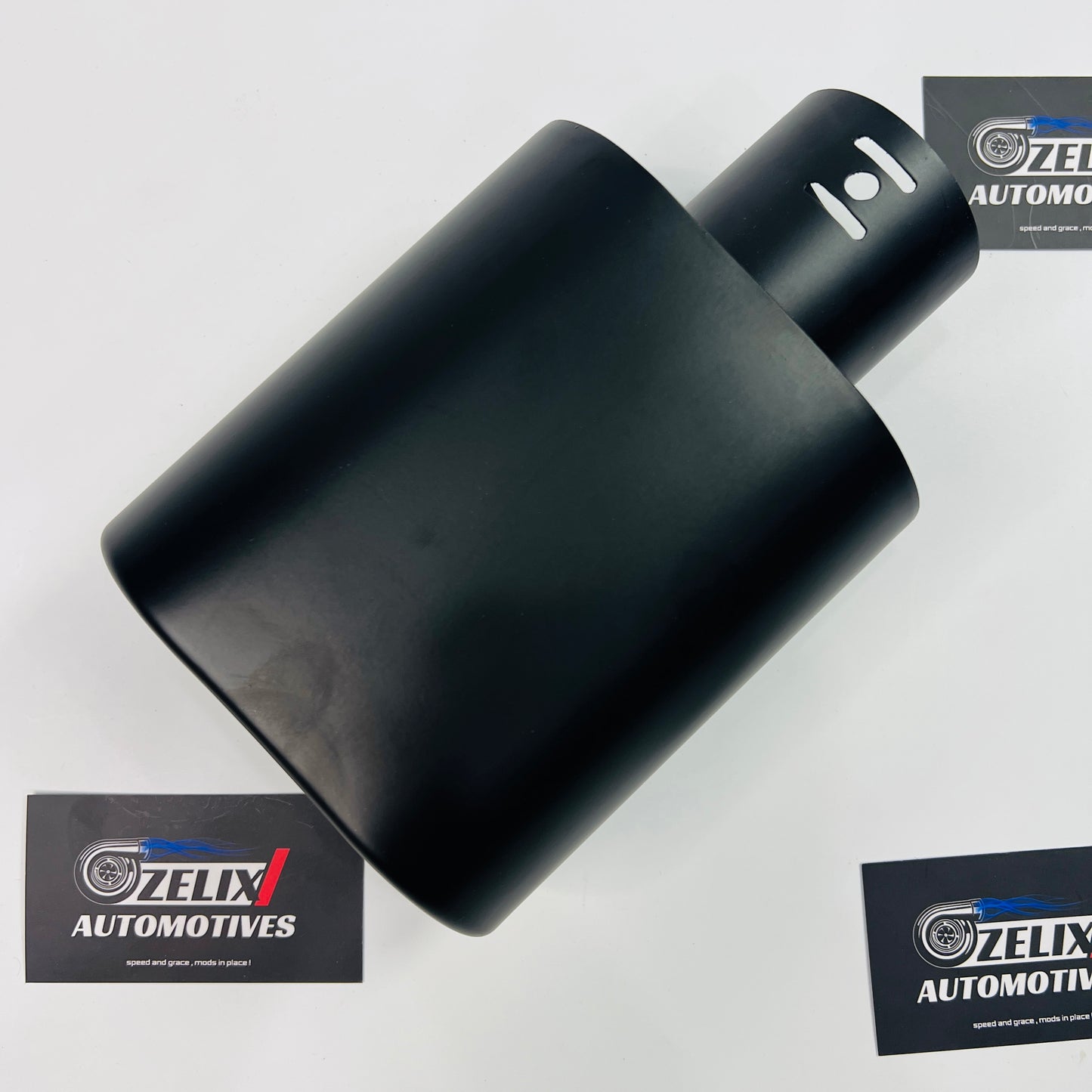Matte oval single exhaust tip displayed at an angled front view