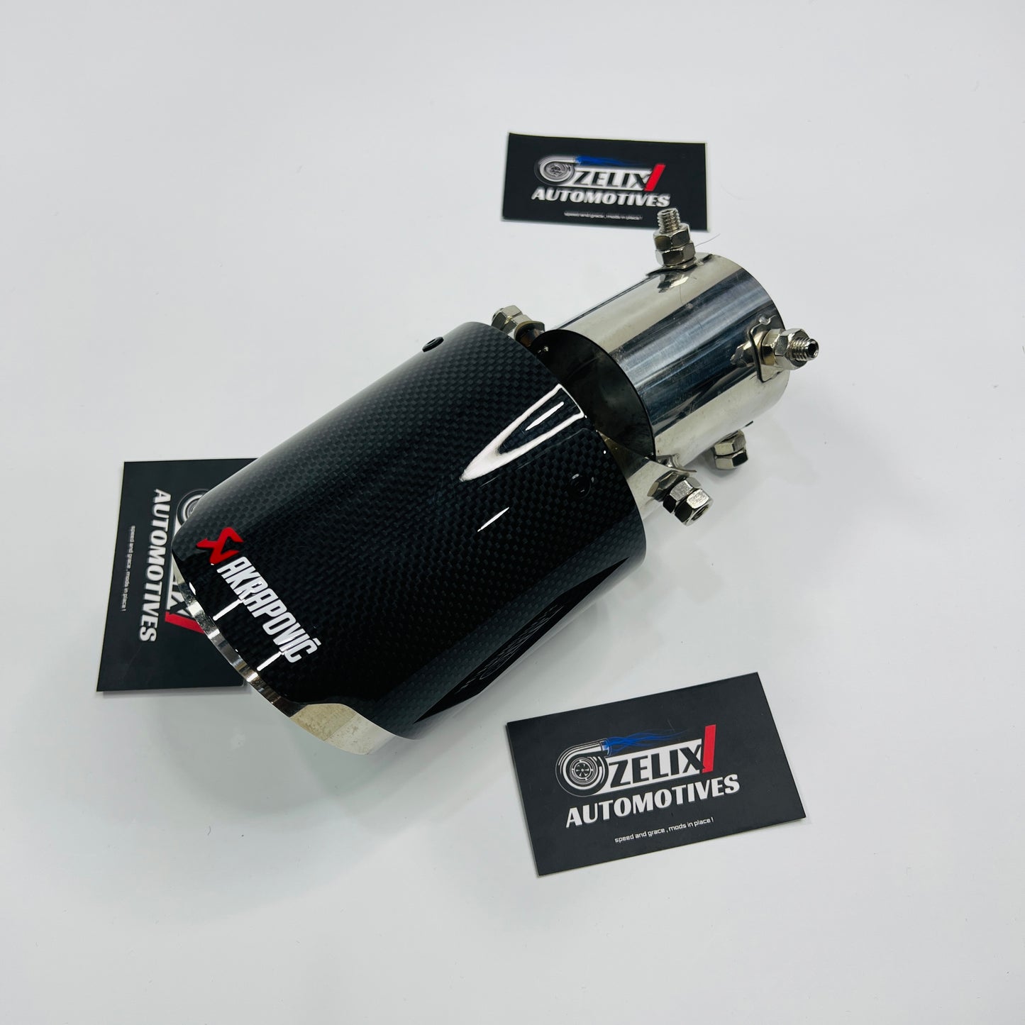 Side angle view of Akrapovic adjustable tip showing mounting mechanism