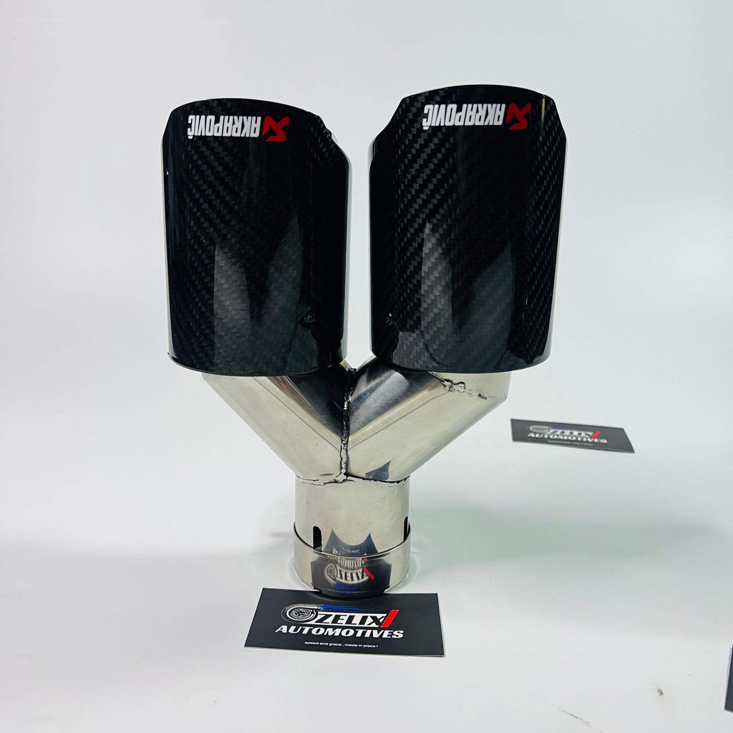 Top view of Akrapovic gloss carbon dual exhaust tip