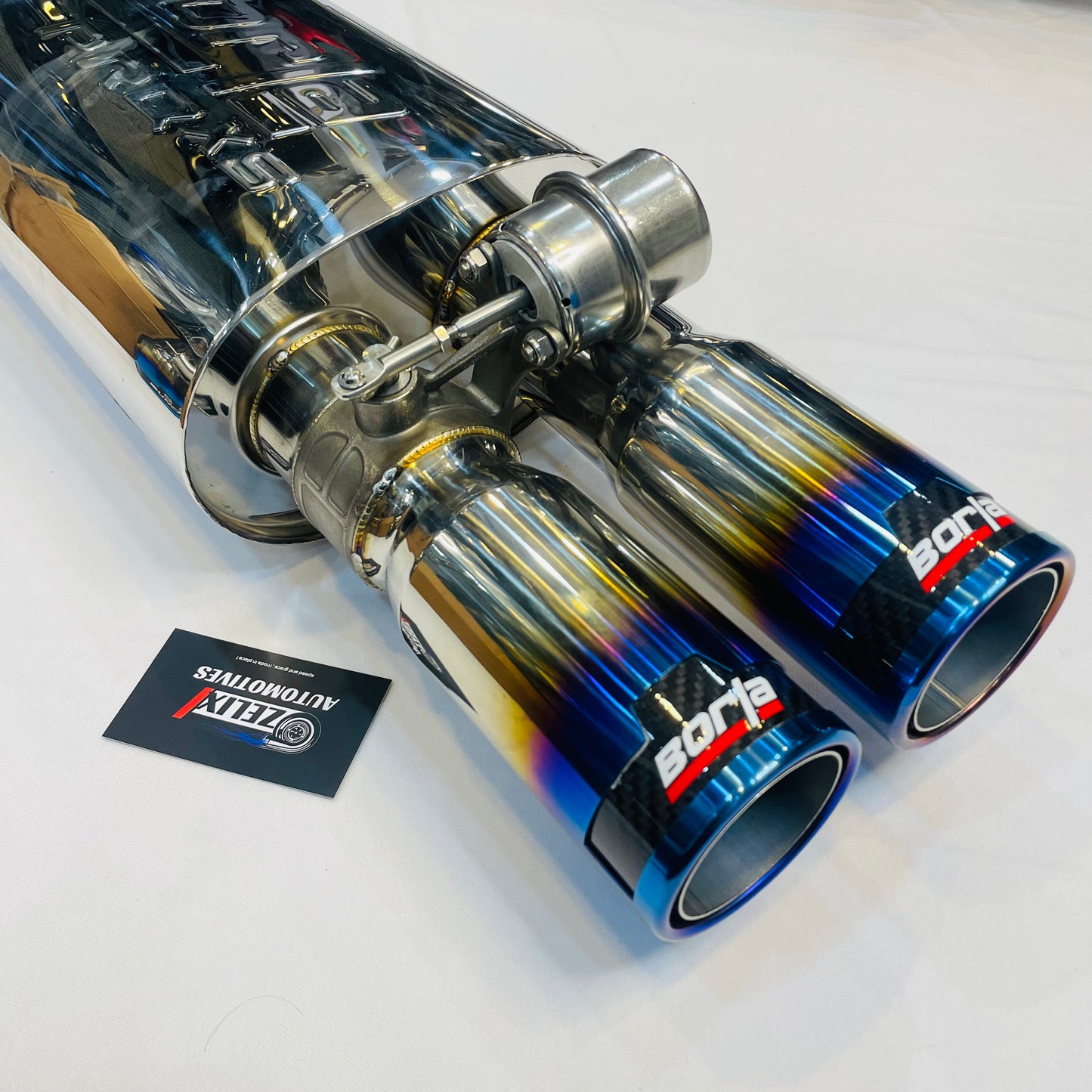 Close-up of burnt dual tips and valve mechanism on Borla exhaust