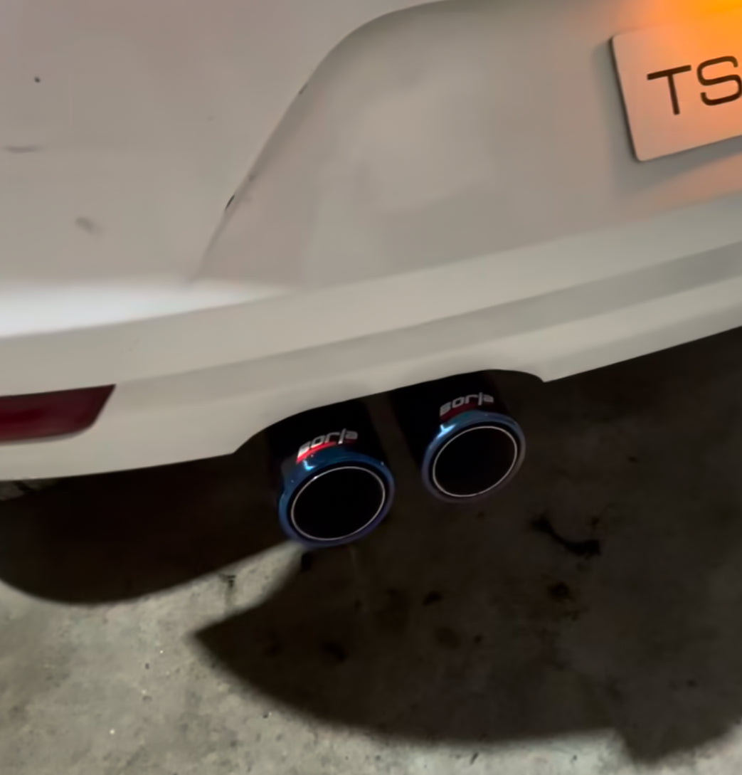 Borla Valvetronic dual-tip burnt exhaust on white background