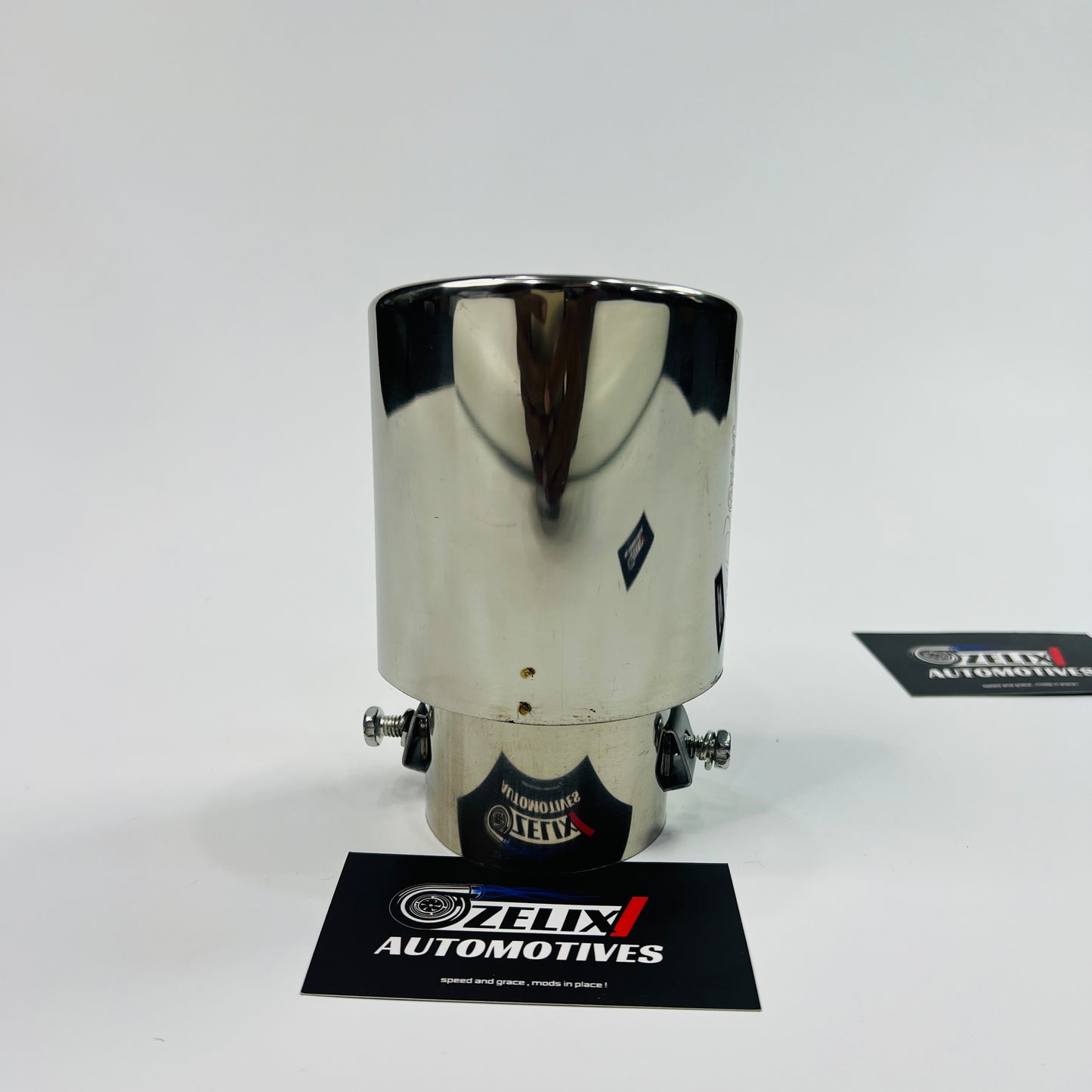 Universal HKS chrome single exhaust tip installed on car