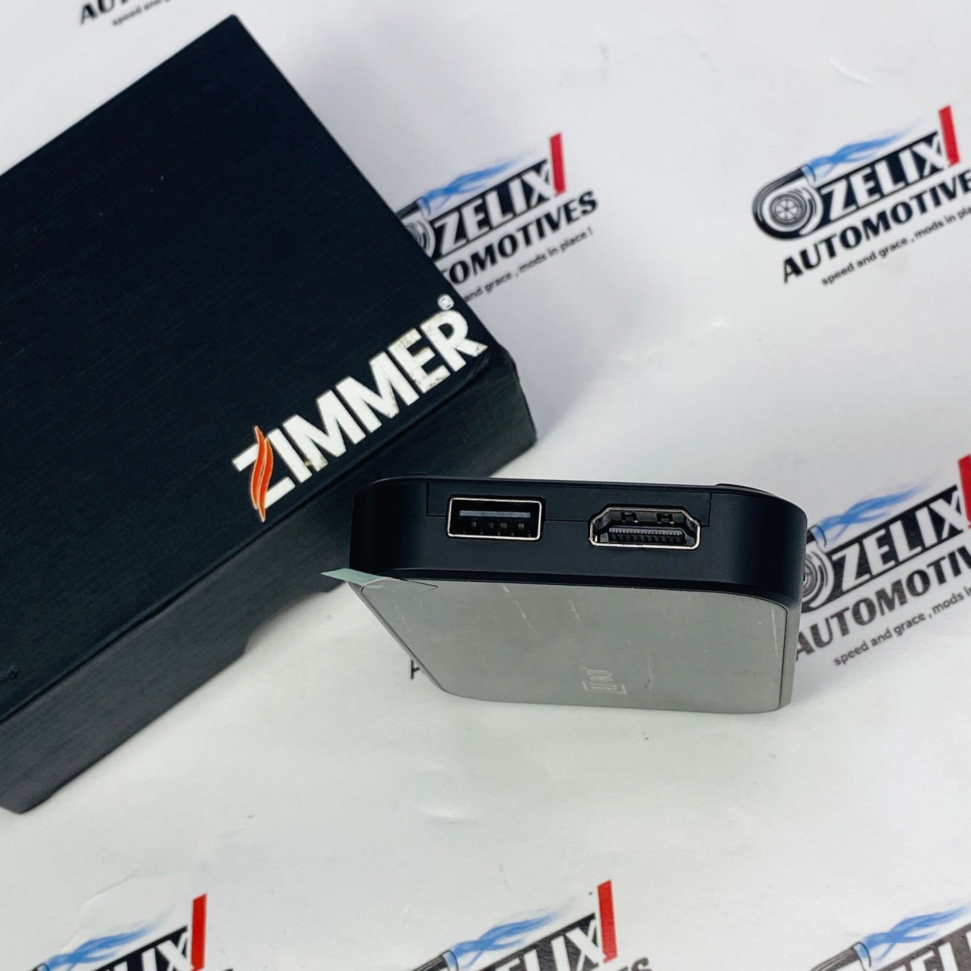 Wireless Zimmer AI Box plug-and-play Android AI adapter with packaging and USB cable included.