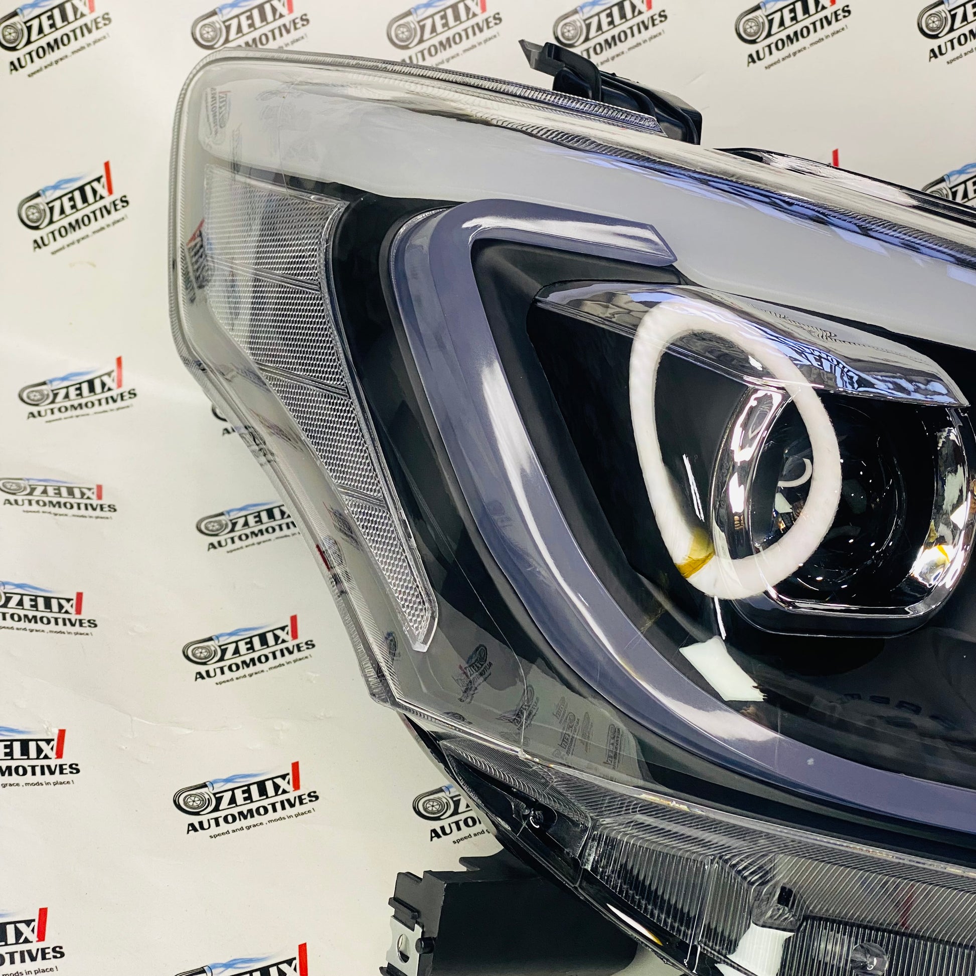 Aftermarket projector headlight set with DRLs for Innova 