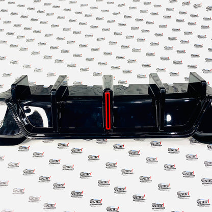 aftermarket BMW G28 B Style rear bumper diffuser in Black color 