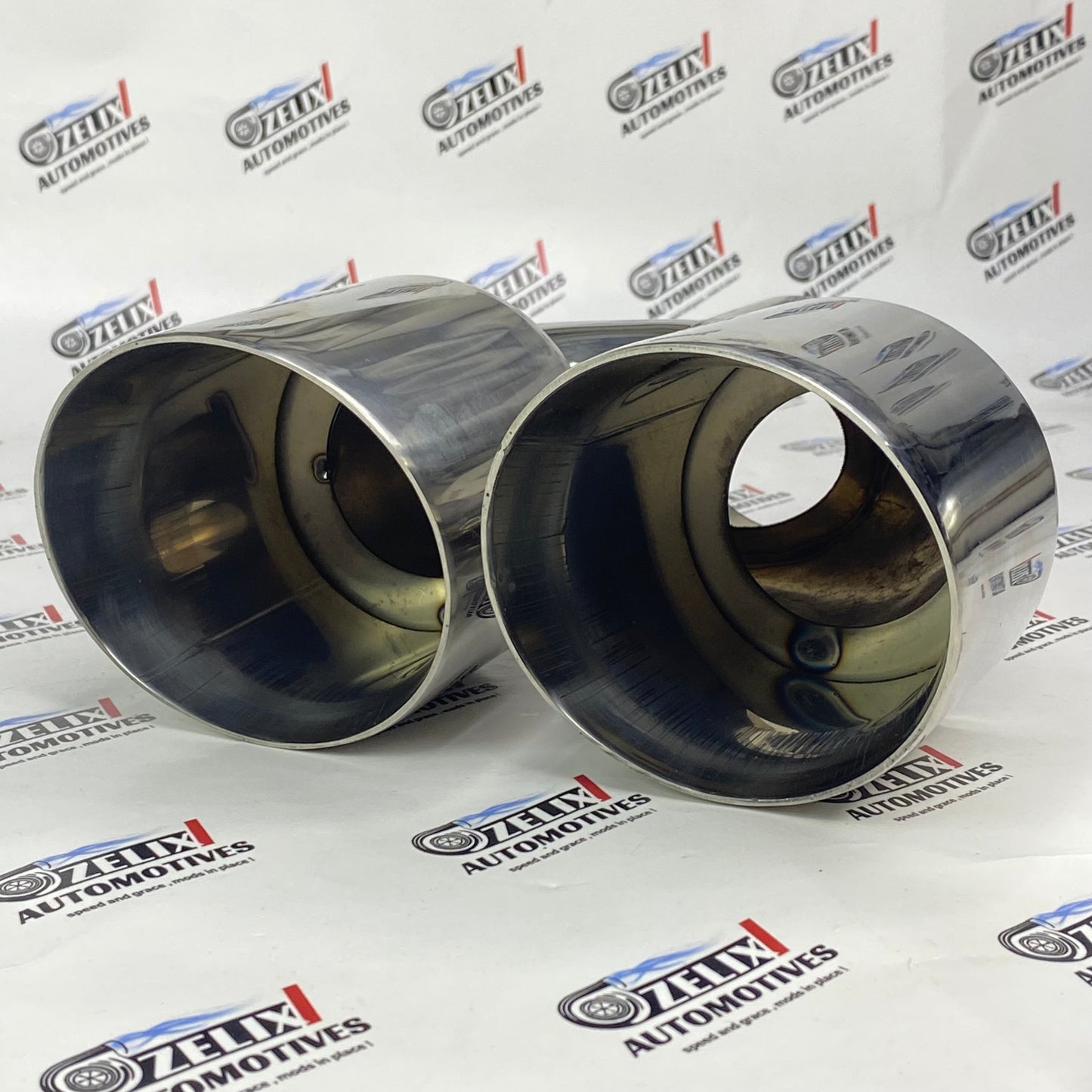 Dual round chrome-finish exhaust tip enhancing car styling 