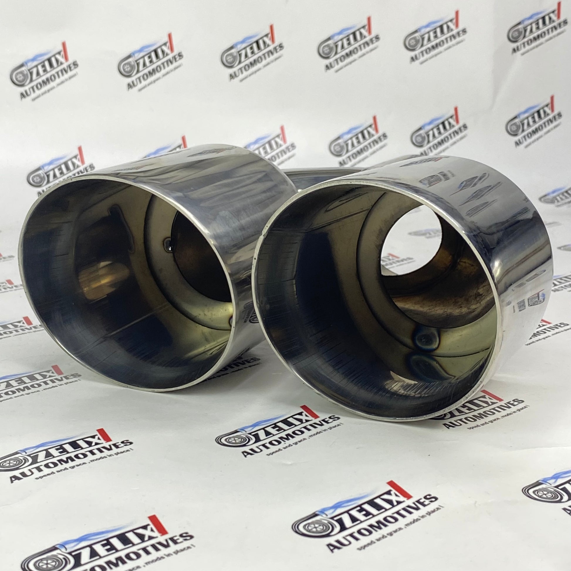 Dual round chrome-finish exhaust tip enhancing car styling 