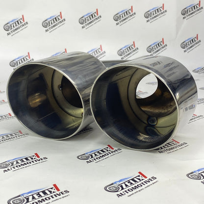 Dual round chrome-finish exhaust tip enhancing car styling 