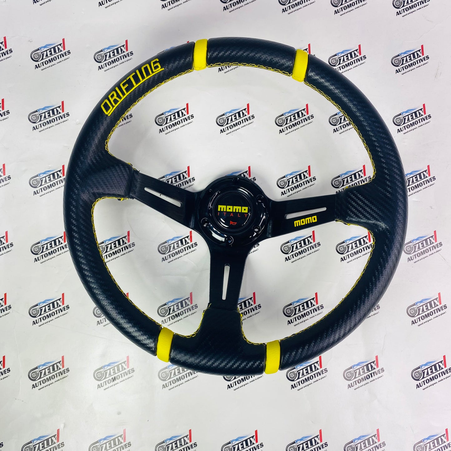 MOMO Drifting Steering Wheel with yellow color stitching