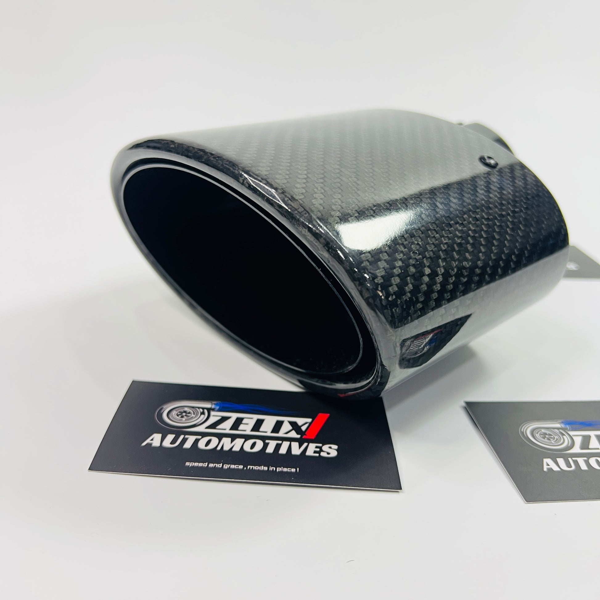 Side profile highlighting the extended length and shiny carbon-fiber wrap