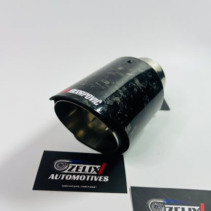 Top-down view emphasizing the oval outlet and intricate carbon fiber pattern