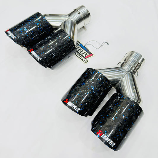 Akrapovic blue forged carbon dual exhaust tip—front display view