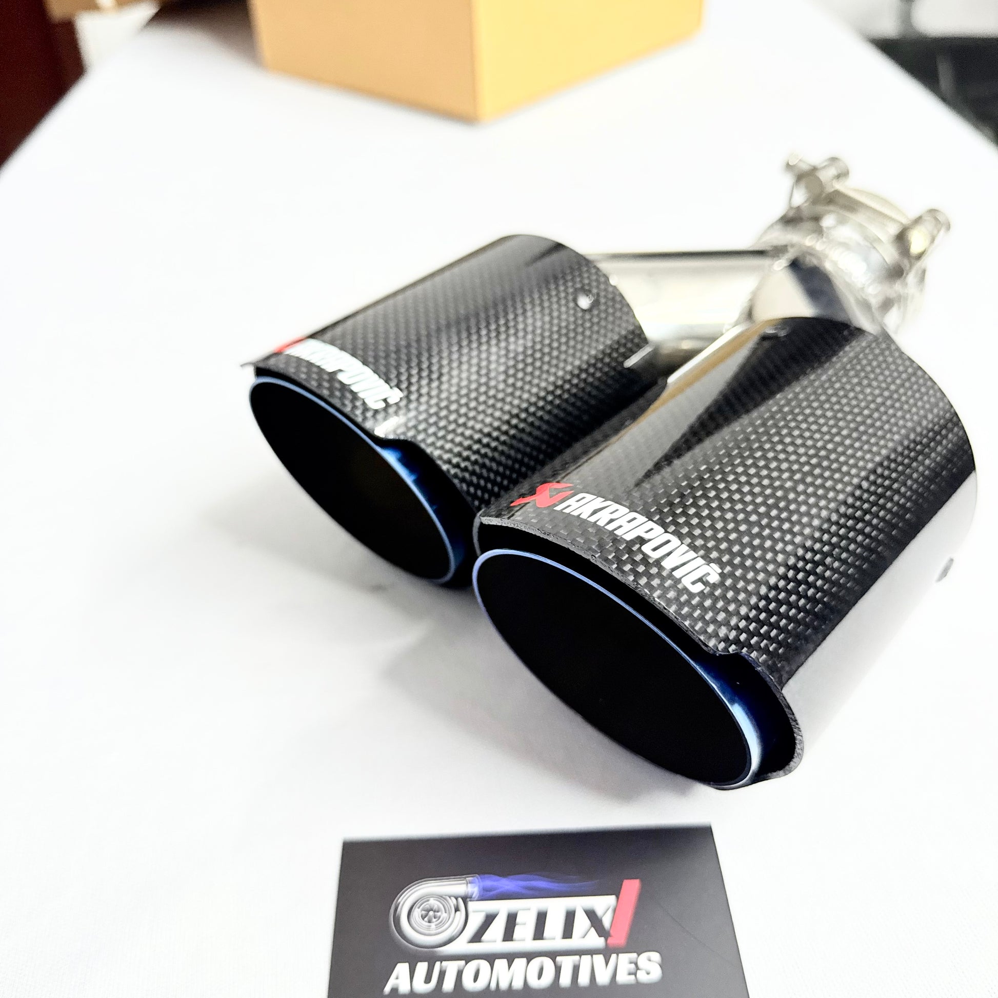 Close-up of the carbon weave surface detail and titanium-burnt finish