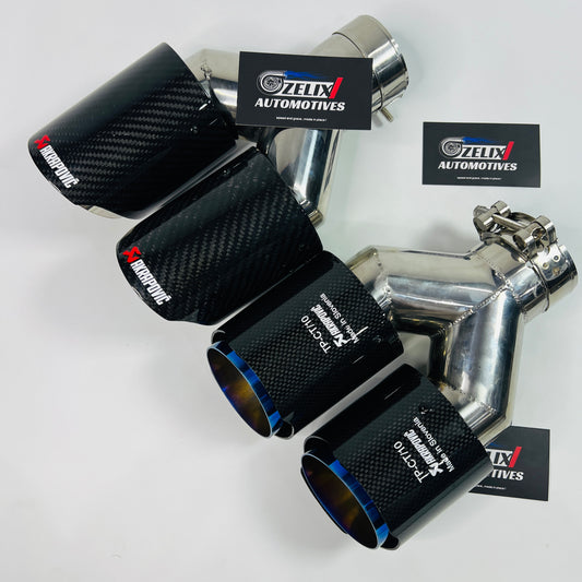 Gloss carbon dual exhaust tip with titanium-burnt outlets shown from the front