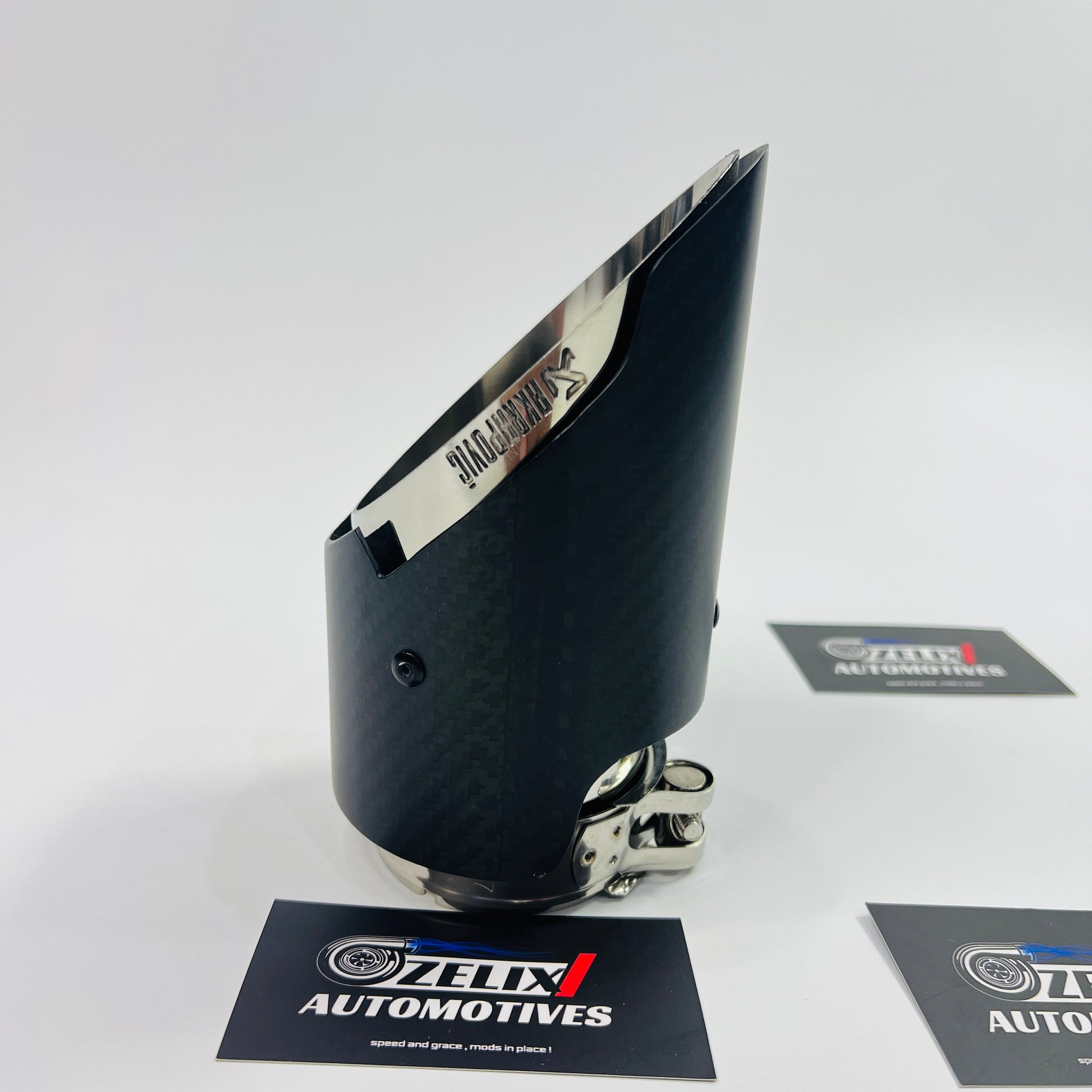 Side profile of the matte carbon single tip showcasing the textured wrap and aggressive slant-cut design