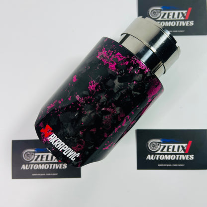 Akrapovic pink forged carbon single exhaust tip shown from the front angle, highlighting its glossy carbon surface and bold coloring.