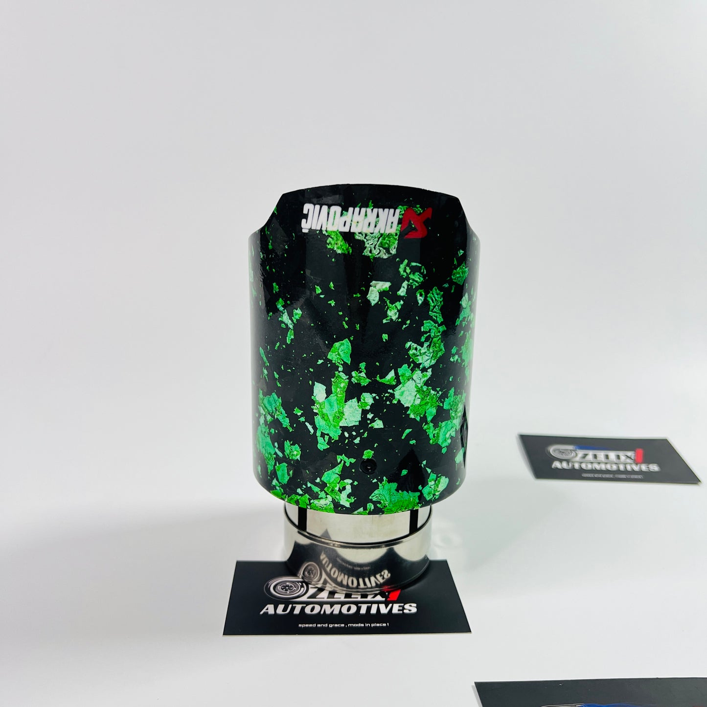 Side profile showcasing the vibrant green forged carbon texture and stainless‑steel core