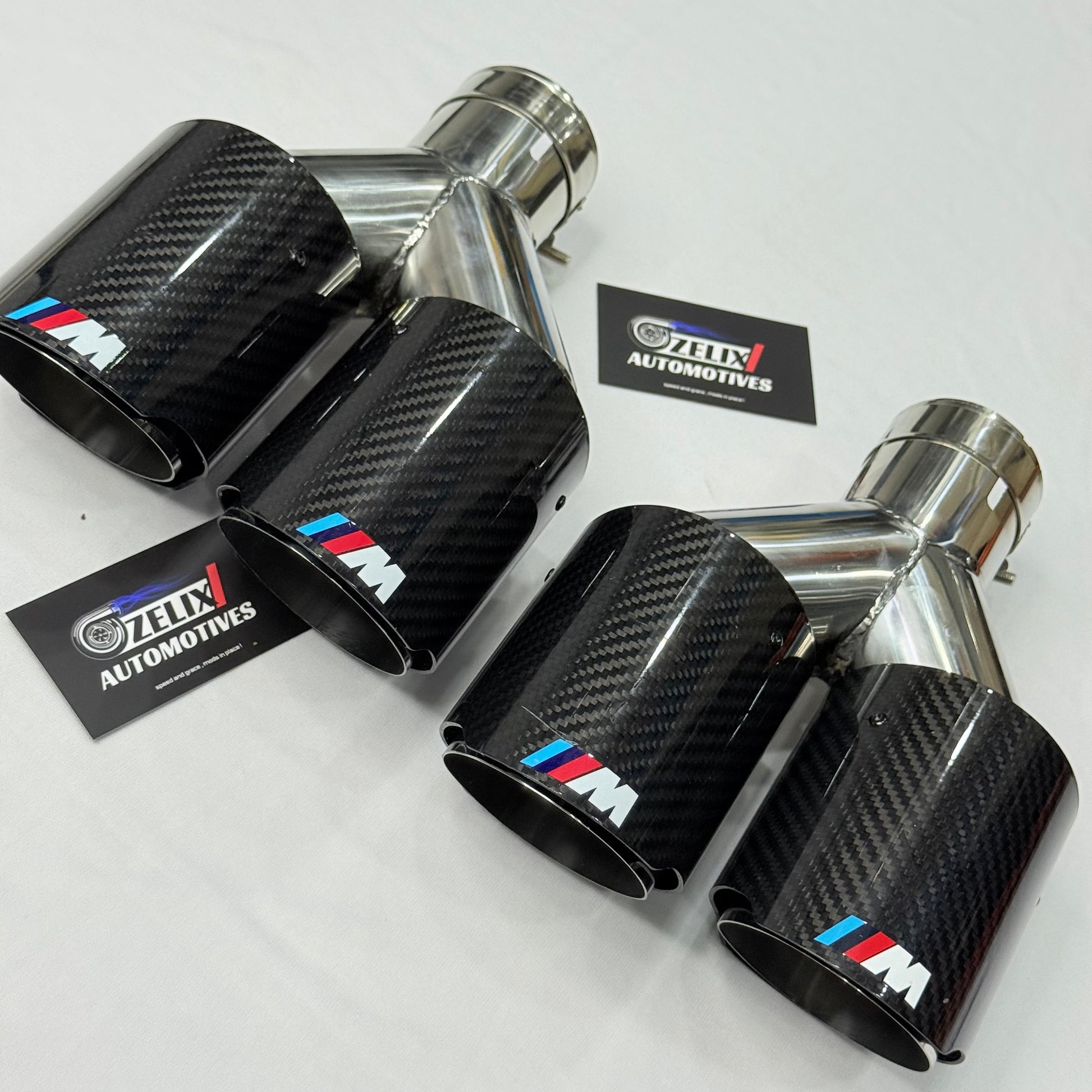 BMW M Performance dual carbon fiber exhaust tip dual outlets, front angle view