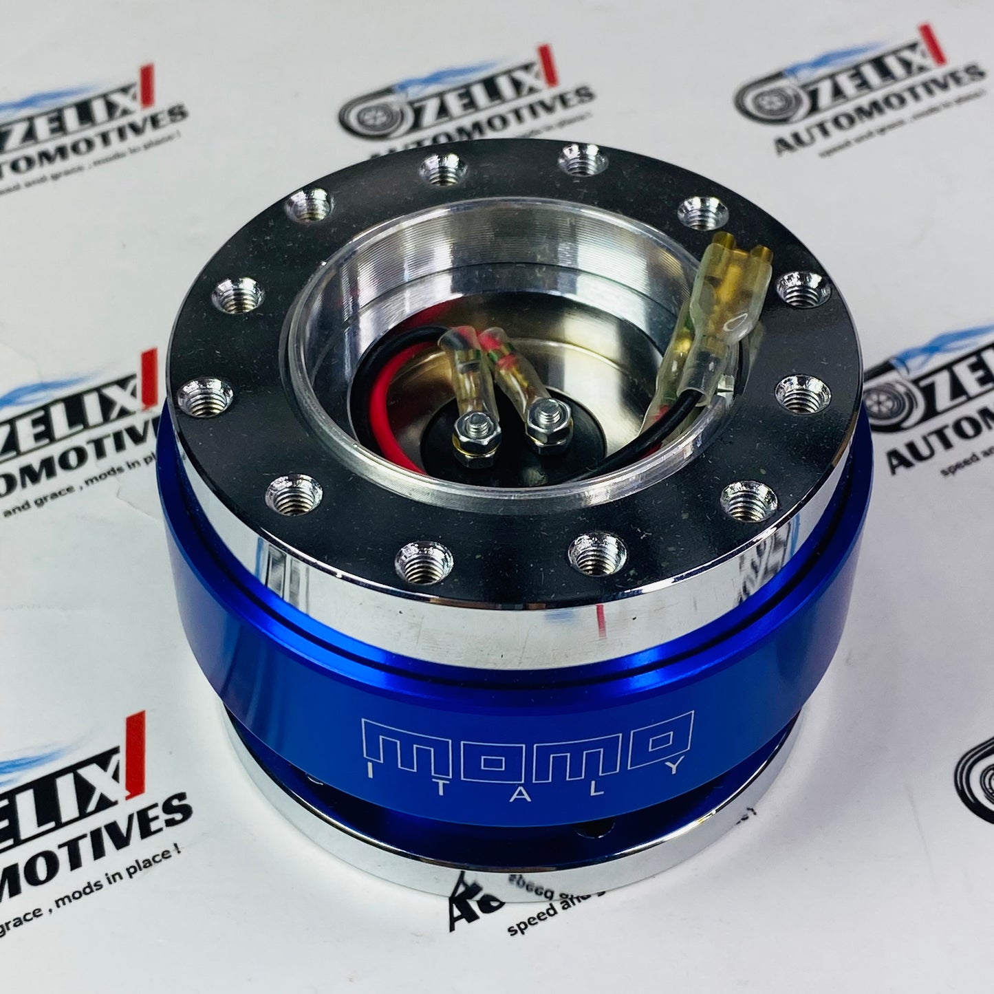 Universal MOMO steering wheel hub adapter in Blue 