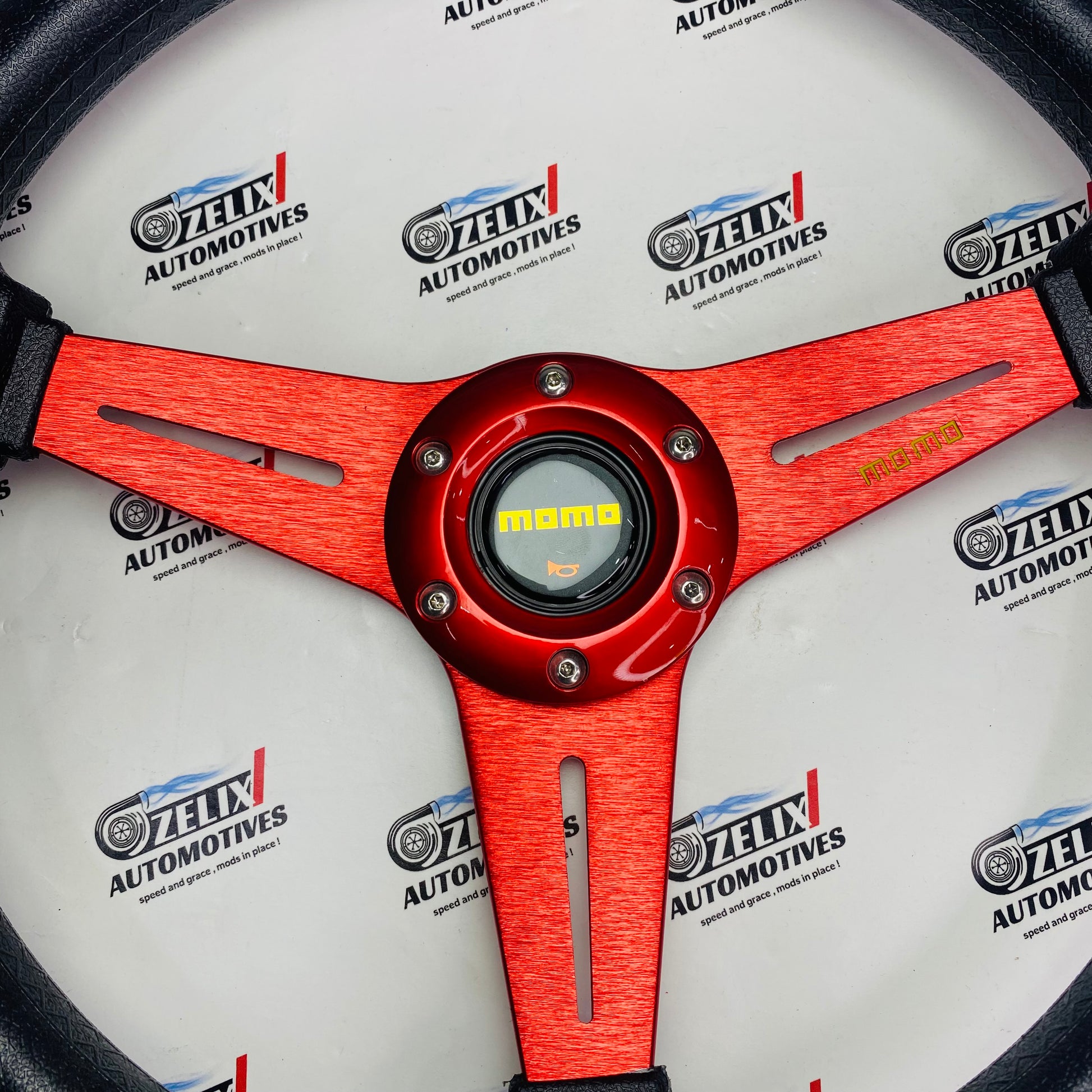 MOMO Flat 3-Spoke steering wheel in red aluminum finish 