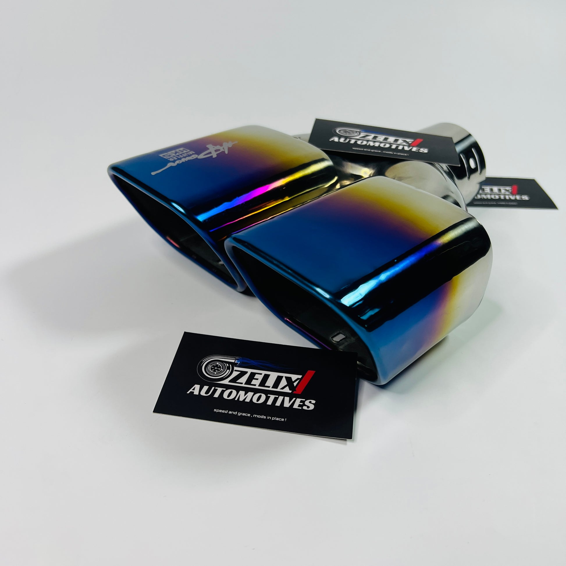 Angled side view of the square twin‑exit stainless steel exhaust tip