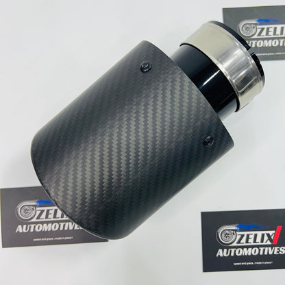 Single tip matte carbon black body exhaust tip shown from the front angle