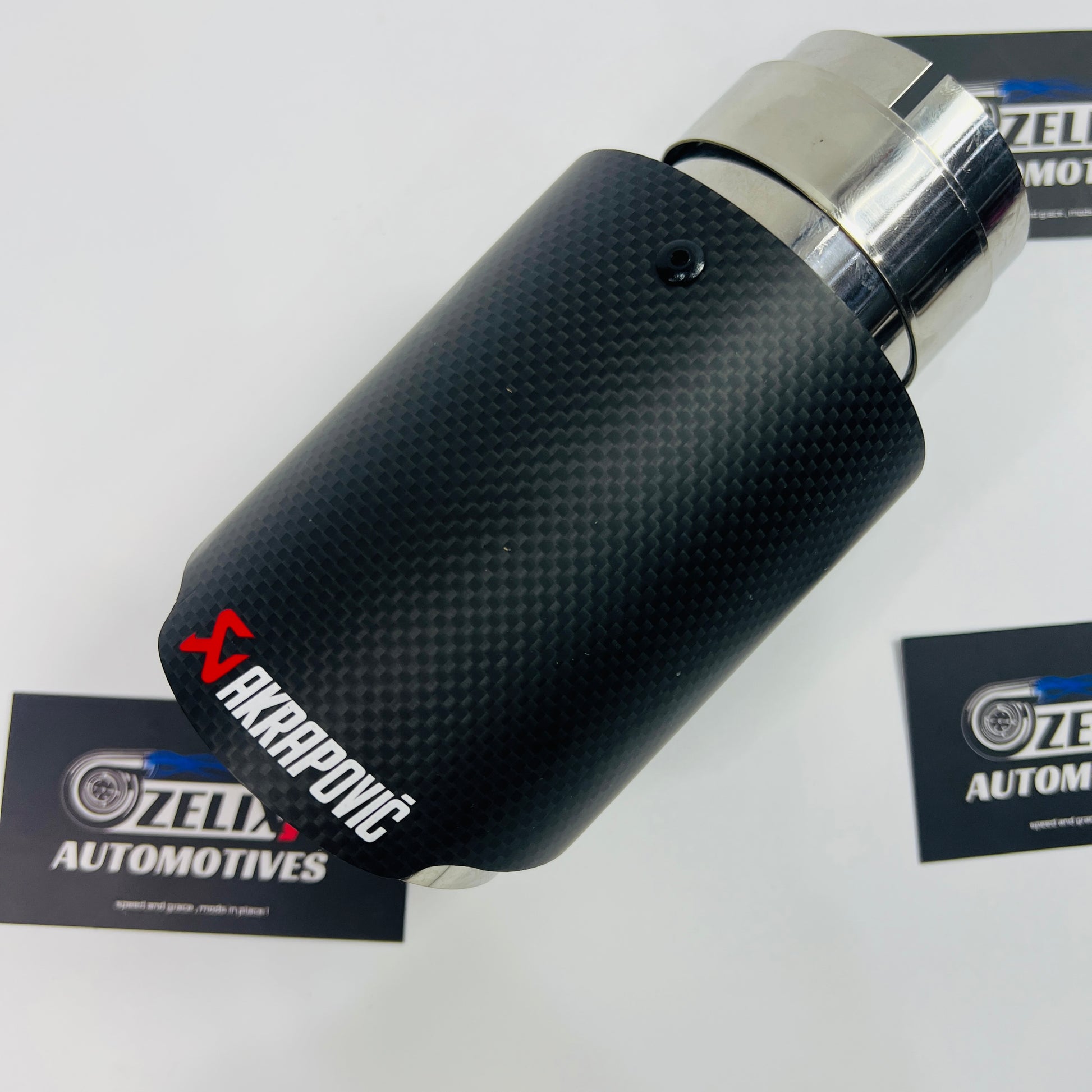 Close-up of matte carbon finish on Akrapovic single exhaust tip