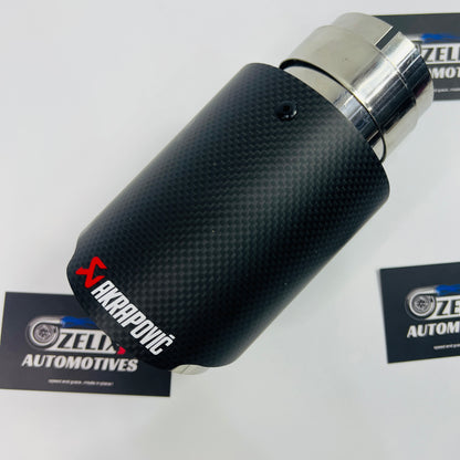 Close-up of matte carbon finish on Akrapovic single exhaust tip