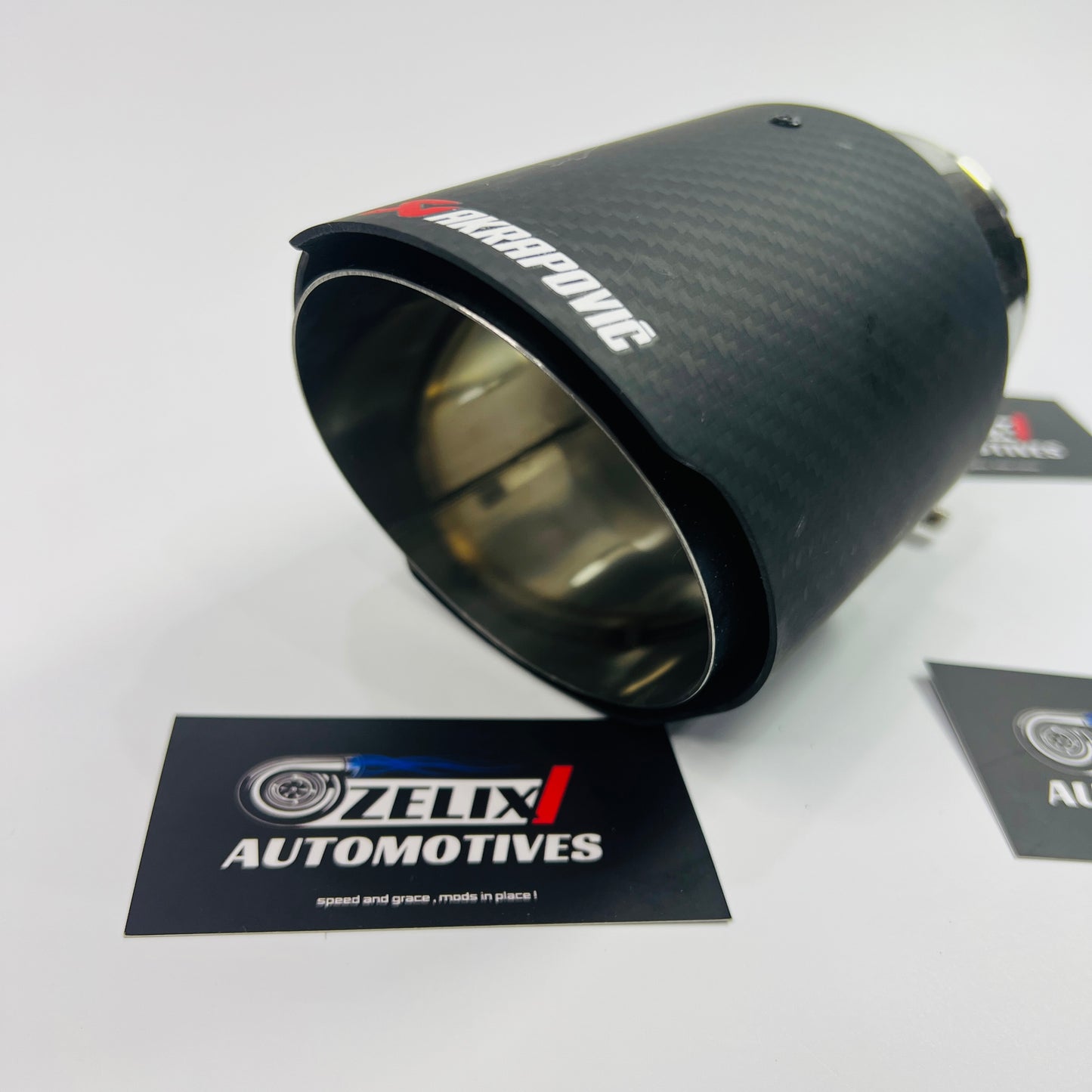 Close-up of outlet on Akrapovic matte carbon exhaust tip