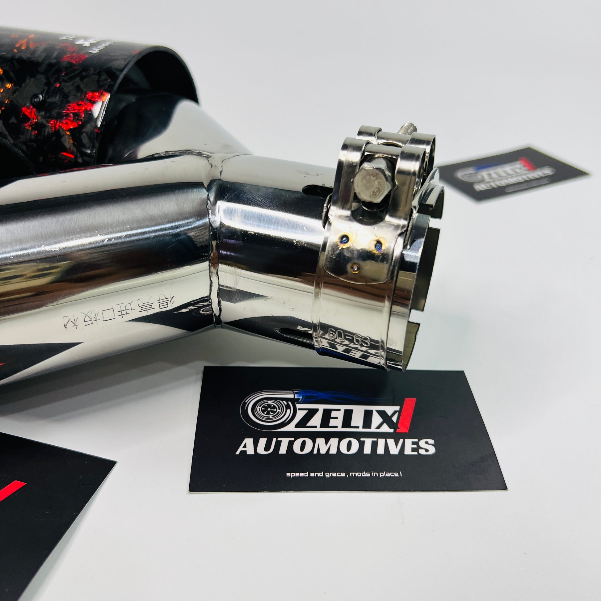 Akrapovic red forged carbon dual exhaust tips installed on car