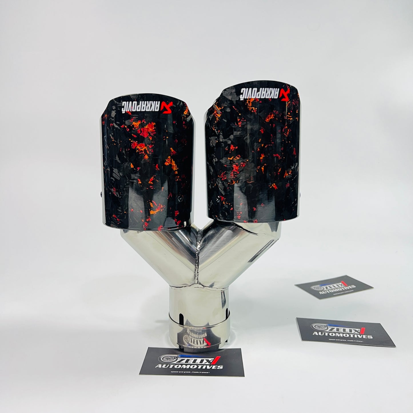 Side view of Akrapovic red forged carbon dual exhaust tips