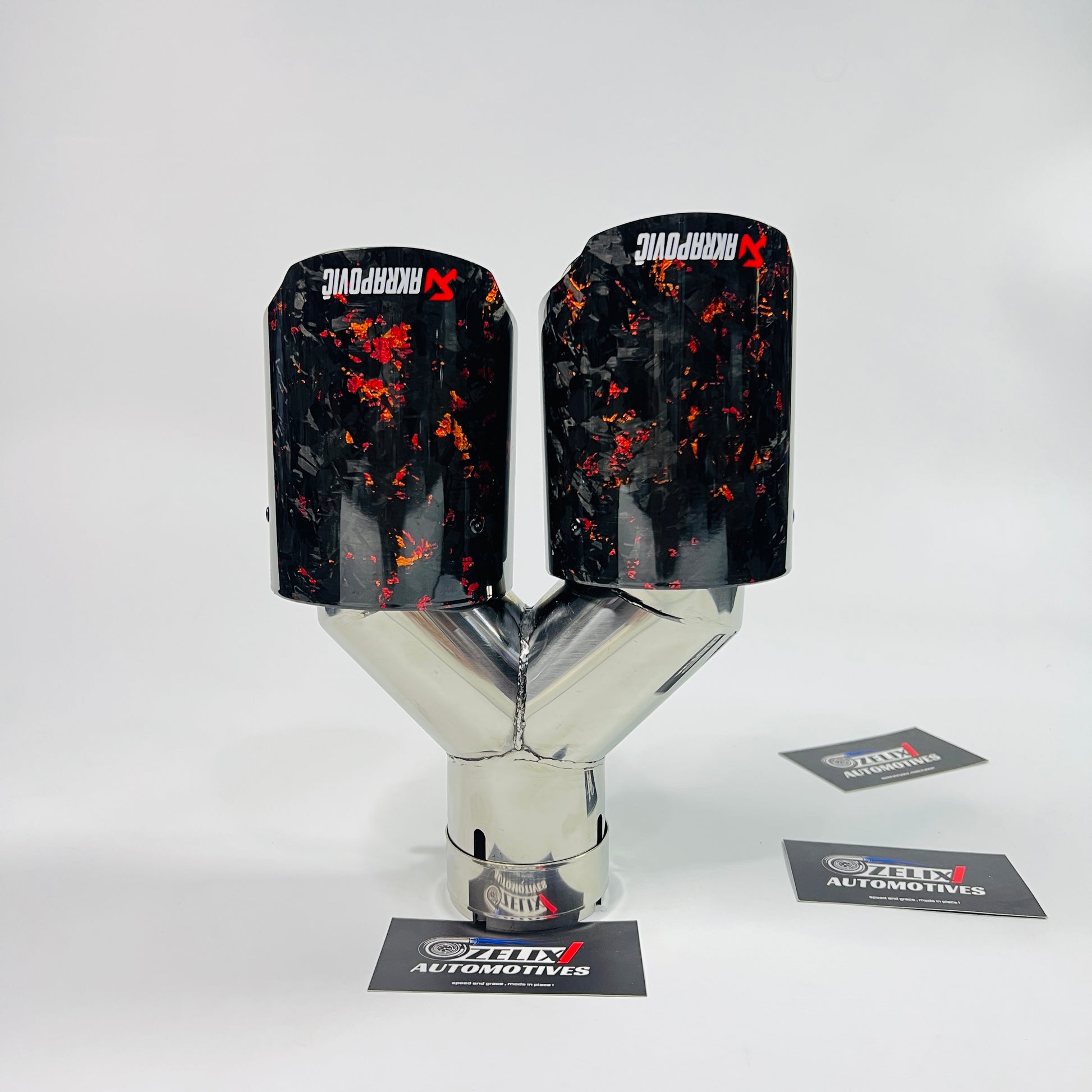 Side view of Akrapovic red forged carbon dual exhaust tips