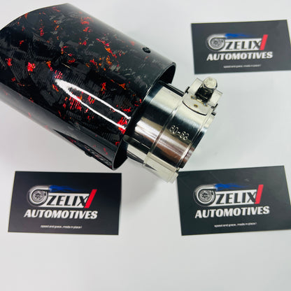 Akrapovic red forged carbon exhaust tip installed on car