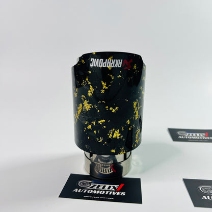 Close-up of yellow forged carbon texture on Akrapovic tip