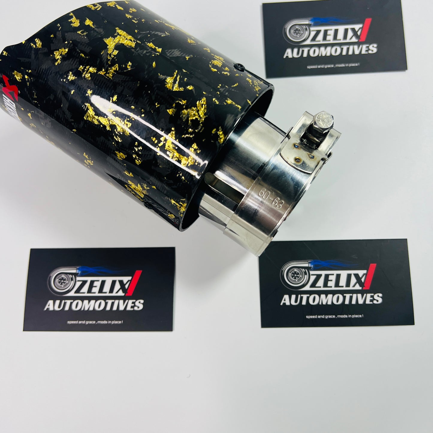 Akrapovic yellow forged carbon tip installed on vehicle exhaust